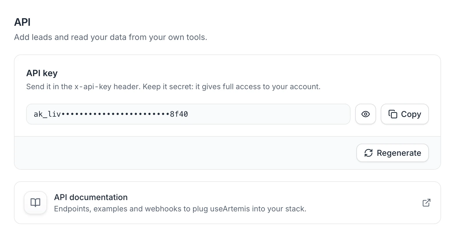 Settings › API with a key: the masked key, the eye icon, Copy, Regenerate and the API documentation link